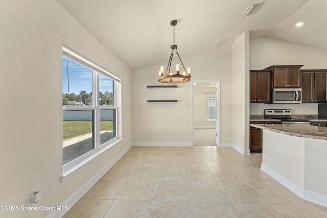 kitchen featuring lofted ceiling, dark brown cabinetry, stainless steel appliances, visible vents, and dark stone countertops