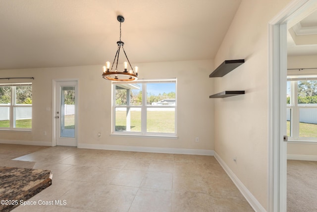 unfurnished dining area featuring light tile patterned floors, baseboards, and a chandelier