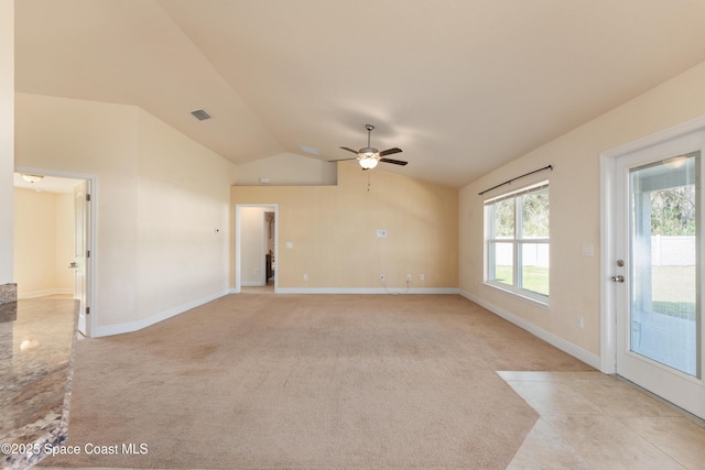 unfurnished living room with lofted ceiling, light carpet, a ceiling fan, visible vents, and baseboards