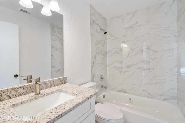 full bath with visible vents, a textured wall, toilet, vanity, and shower / tub combination