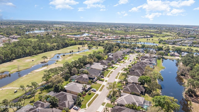 bird's eye view featuring a water view, view of golf course, and a residential view