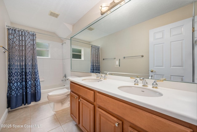 bathroom with toilet, tile patterned flooring, visible vents, and a sink