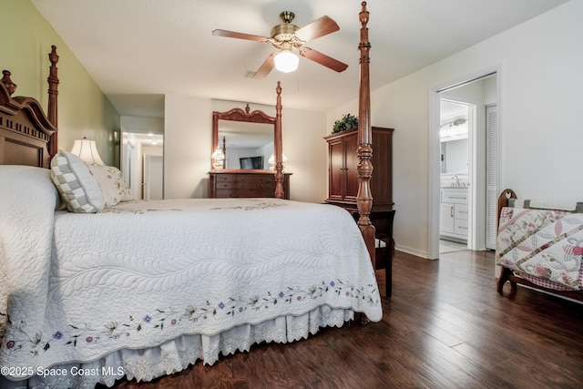 bedroom with a sink, ceiling fan, wood finished floors, and ensuite bathroom