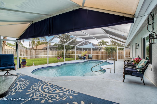 view of pool featuring a patio, a fenced backyard, a fenced in pool, and a lanai