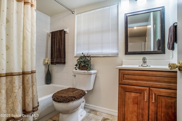 full bath with vanity, shower / bath combo with shower curtain, toilet, and baseboards