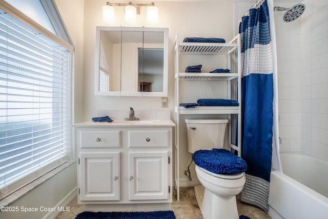 bathroom with shower / tub combo with curtain, vanity, and toilet