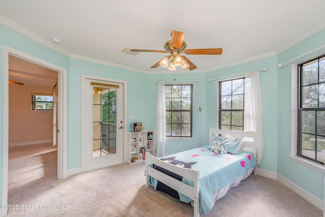 carpeted bedroom with ornamental molding, access to outside, and baseboards