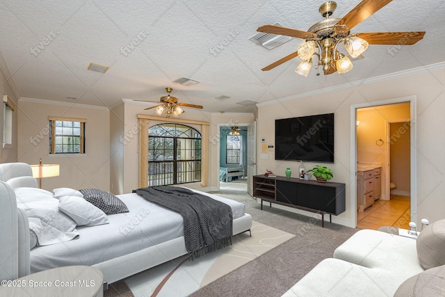 bedroom with carpet floors, ornamental molding, and visible vents