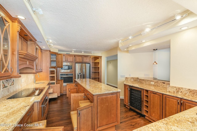 kitchen with open shelves, beverage cooler, appliances with stainless steel finishes, and a sink