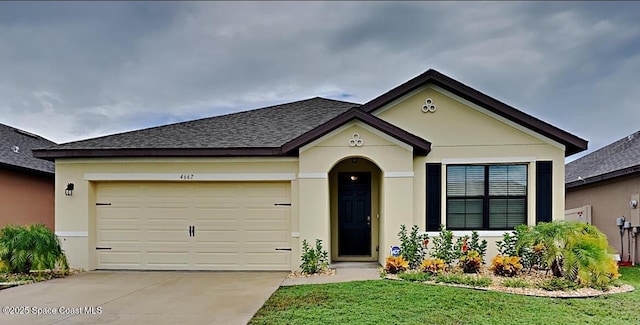 ranch-style home featuring roof with shingles, stucco siding, an attached garage, driveway, and a front lawn