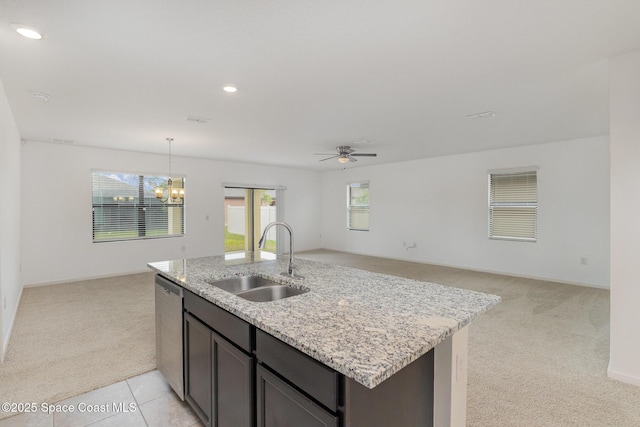 kitchen with a sink, light colored carpet, open floor plan, dishwasher, and recessed lighting
