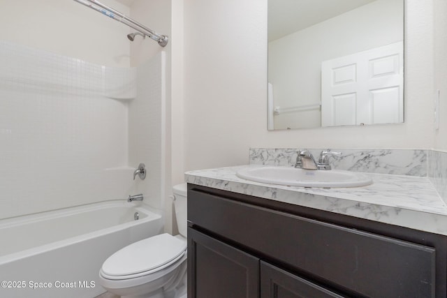 bathroom featuring toilet, vanity, and shower / bathtub combination