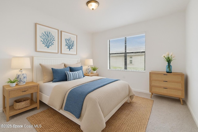 bedroom with light carpet and baseboards