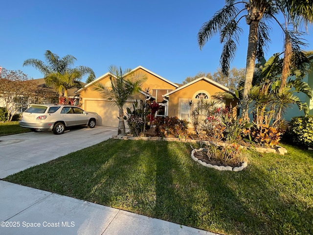 view of front of house with a garage, a front yard, concrete driveway, and stucco siding