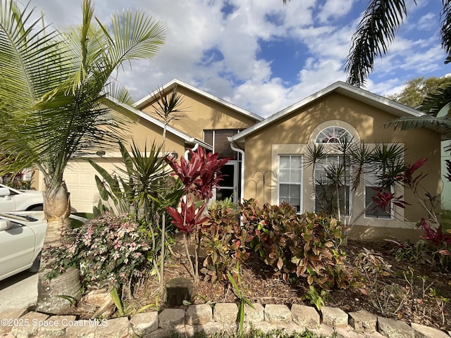 exterior space featuring a garage and stucco siding