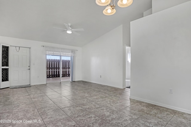 unfurnished living room with a ceiling fan, vaulted ceiling, and baseboards