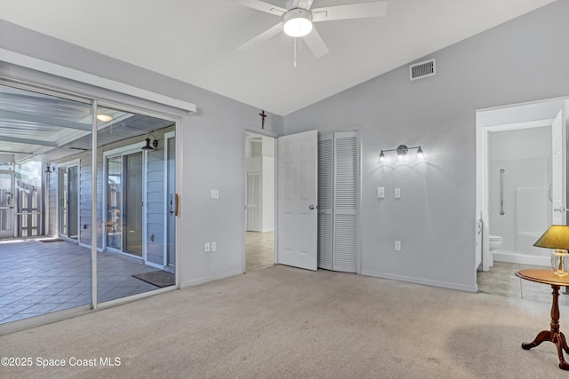 unfurnished bedroom featuring lofted ceiling, visible vents, carpet flooring, access to outside, and baseboards