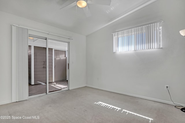 unfurnished bedroom with carpet floors, baseboards, and a ceiling fan