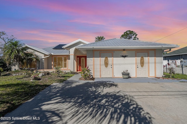 1824 Emerson Dr SE, Palm Bay, FL 32909 - view of front of property featuring metal roof and fence
