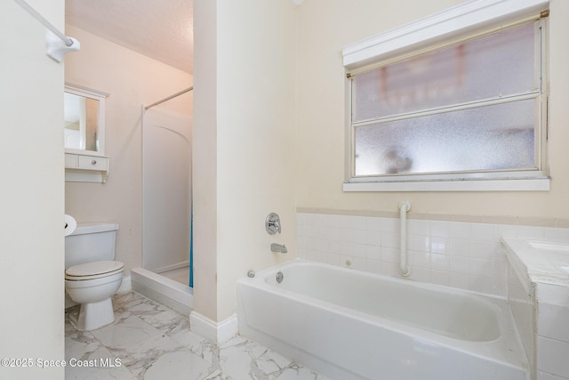 full bathroom featuring a shower, marble finish floor, a garden tub, toilet, and baseboards