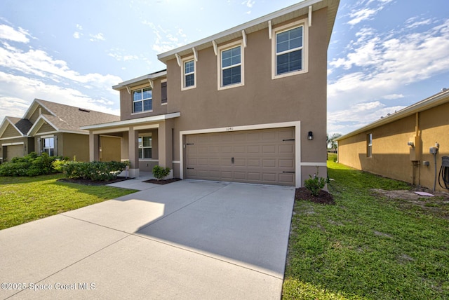 view of front of property with concrete driveway, a front lawn, an attached garage, and stucco siding