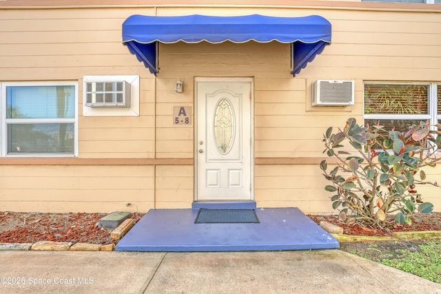 entrance to property with an AC wall unit