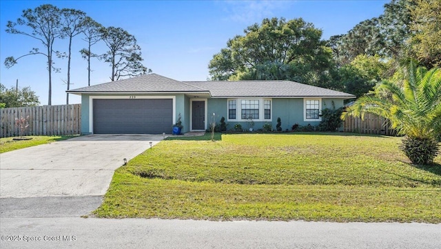 ranch-style house featuring concrete driveway, an attached garage, fence, a front yard, and stucco siding