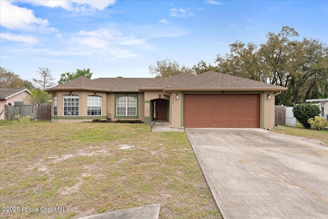 ranch-style house with an attached garage, fence, and stucco siding