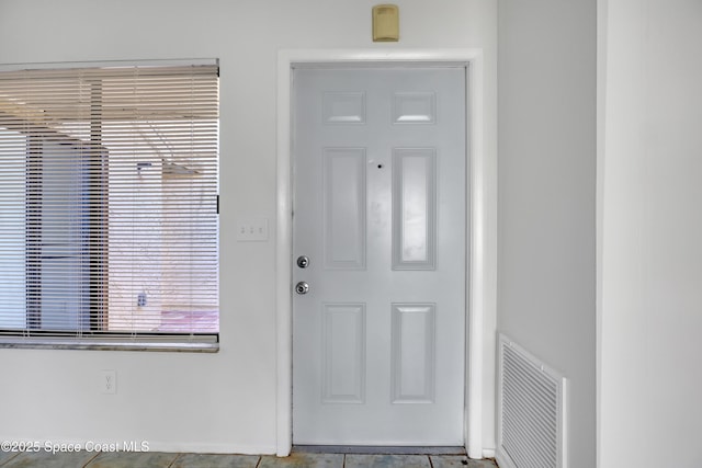 doorway to property featuring visible vents