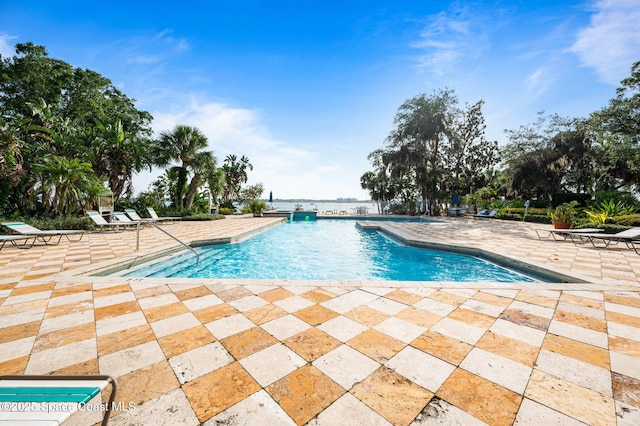 community pool with a patio area