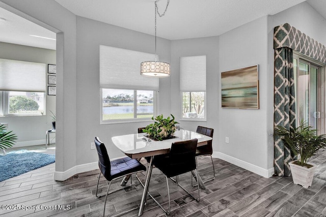 3465 Diamond Leaf Dr, Vero Beach, FL 32966 - dining space featuring wood finish floors and baseboards