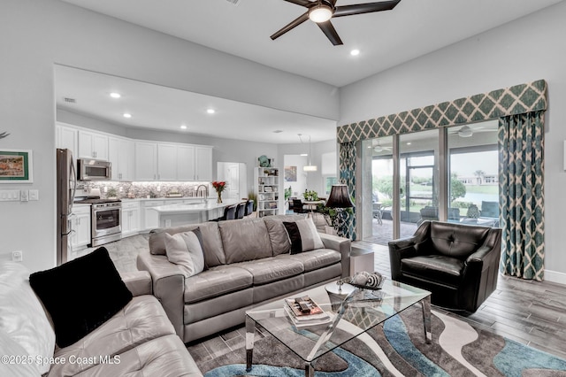 3465 Diamond Leaf Dr, Vero Beach, FL 32966 - living area featuring light wood-type flooring, ceiling fan, baseboards, and recessed lighting