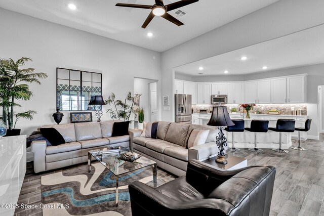 3465 Diamond Leaf Dr, Vero Beach, FL 32966 - living room with light wood-type flooring, visible vents, a ceiling fan, and recessed lighting