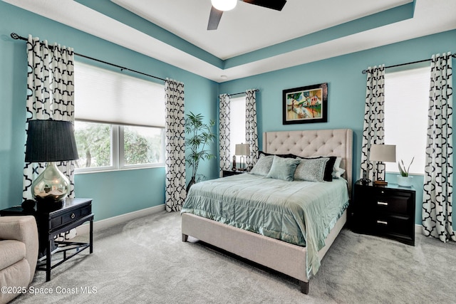 3465 Diamond Leaf Dr, Vero Beach, FL 32966 - carpeted bedroom featuring a ceiling fan, a raised ceiling, and baseboards