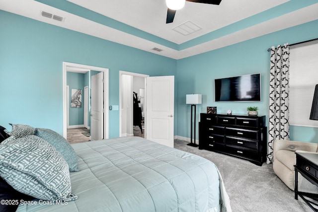 3465 Diamond Leaf Dr, Vero Beach, FL 32966 - carpeted bedroom featuring baseboards, visible vents, ceiling fan, and a raised ceiling