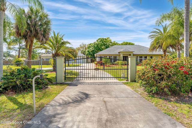 view of gate with fence