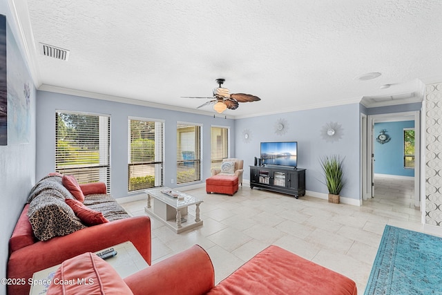 living room with crown molding, baseboards, visible vents, and a textured ceiling