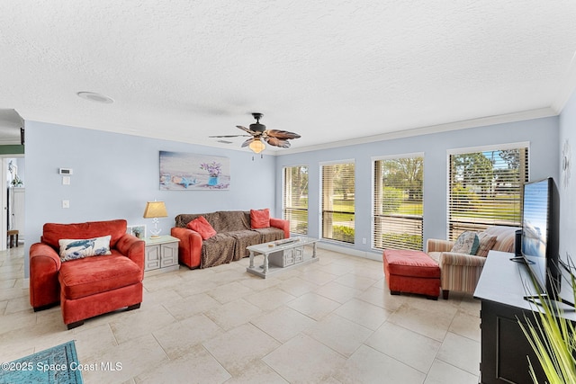 living room with a ceiling fan, a textured ceiling, and crown molding