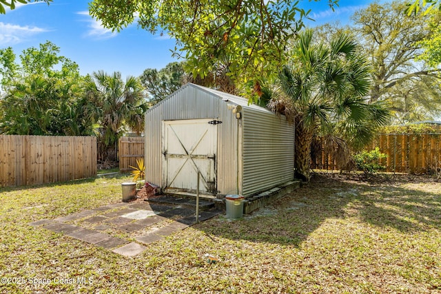 view of shed featuring a fenced backyard