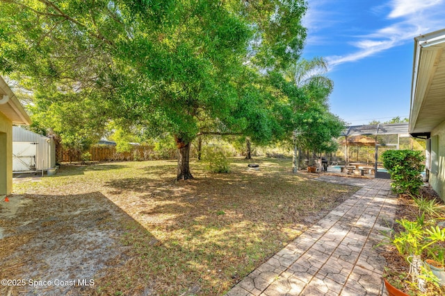 view of yard featuring a patio area and a fenced backyard