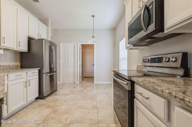 kitchen featuring pendant lighting, appliances with stainless steel finishes, white cabinets, light tile patterned flooring, and baseboards