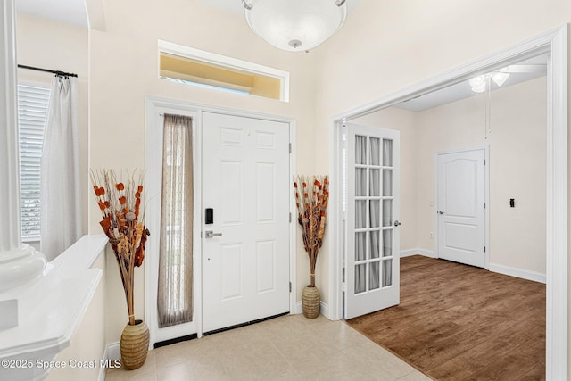 entrance foyer featuring wood finished floors and baseboards