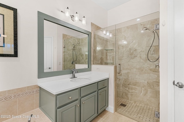 bathroom featuring tile patterned floors, vanity, and a shower stall