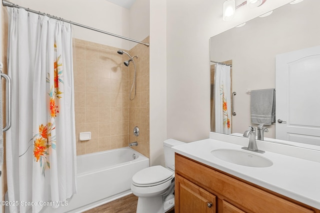 full bathroom with wood finished floors, toilet, vanity, and shower / bath combo