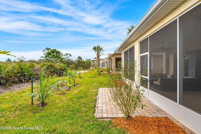 view of yard featuring a sunroom