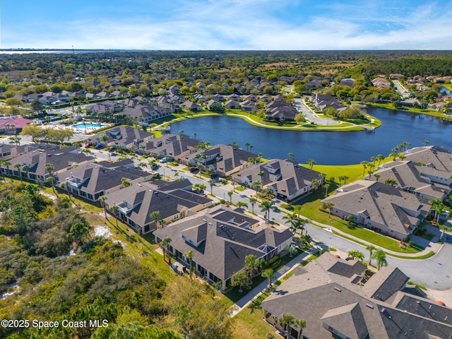 aerial view featuring a residential view and a water view