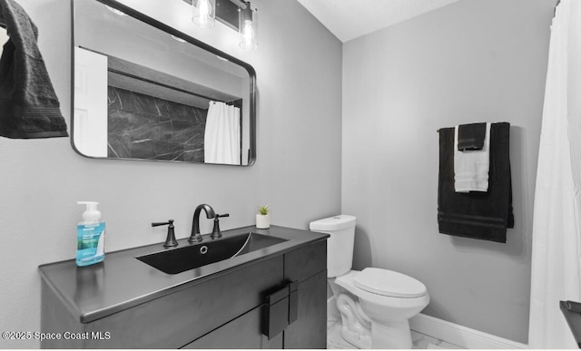 full bath with marble finish floor, toilet, vanity, and baseboards