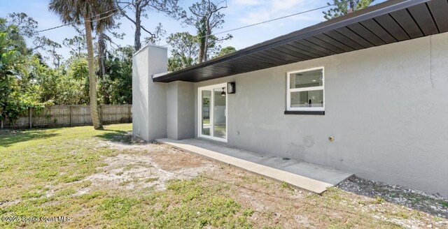 view of yard featuring a patio and fence