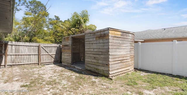 view of outbuilding with a fenced backyard