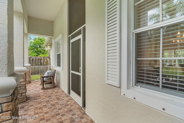 view of patio featuring fence